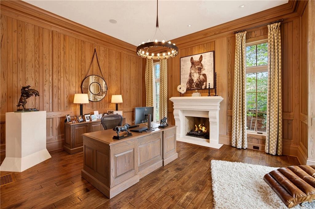 5148 Powers Ferry Road Northwest Sandy Springs, GA 30327 - Photo 15 of 63 a living room with furniture a chandelier and a fireplace