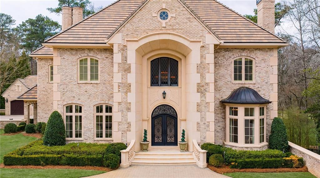 5148 Powers Ferry Road Northwest Sandy Springs, GA 30327 - Photo 2 of 63 a front view of a house