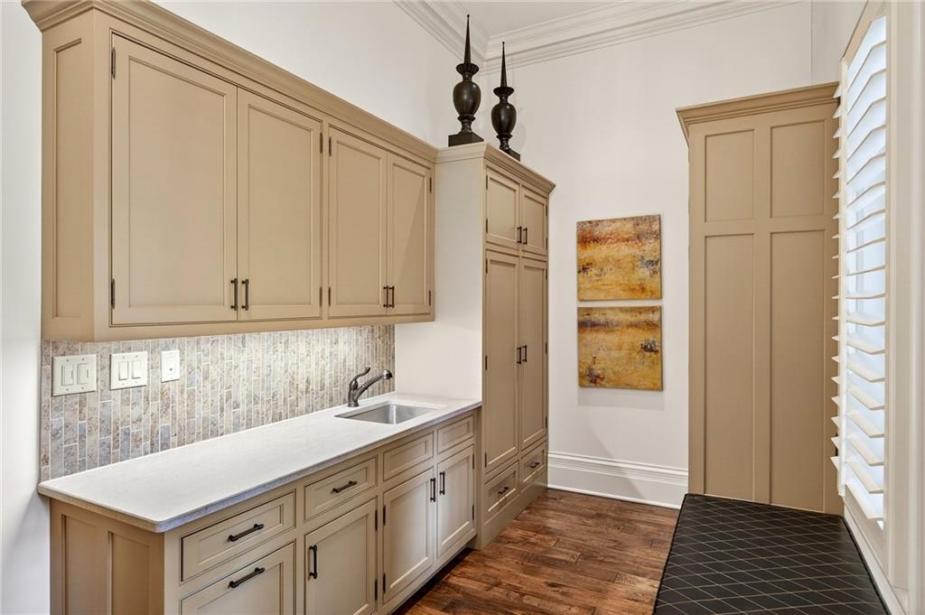 5148 Powers Ferry Road Northwest Sandy Springs, GA 30327 - Photo 22 of 63 a spacious bathroom with a sink a mirror and a shower
