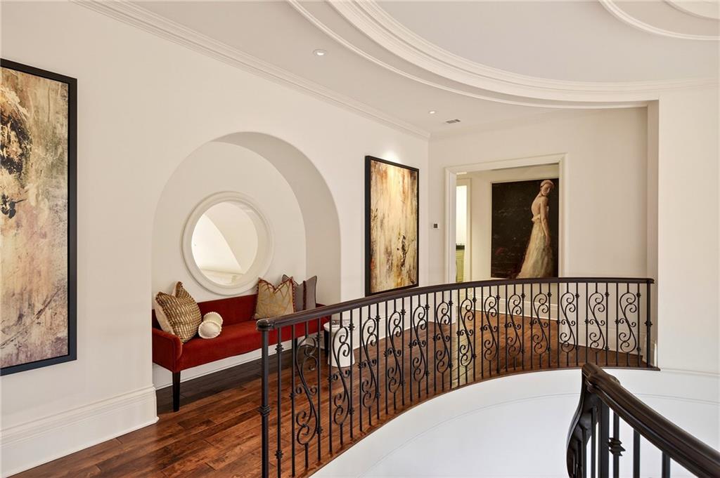 5148 Powers Ferry Road Northwest Sandy Springs, GA 30327 - Photo 23 of 63 a view of a hallway with wooden floor and windows