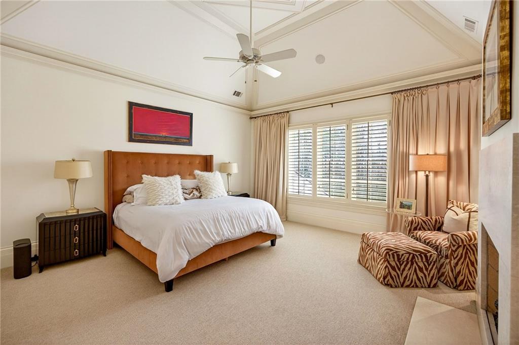 5148 Powers Ferry Road Northwest Sandy Springs, GA 30327 - Photo 24 of 63 a spacious bedroom with a bed and a couch