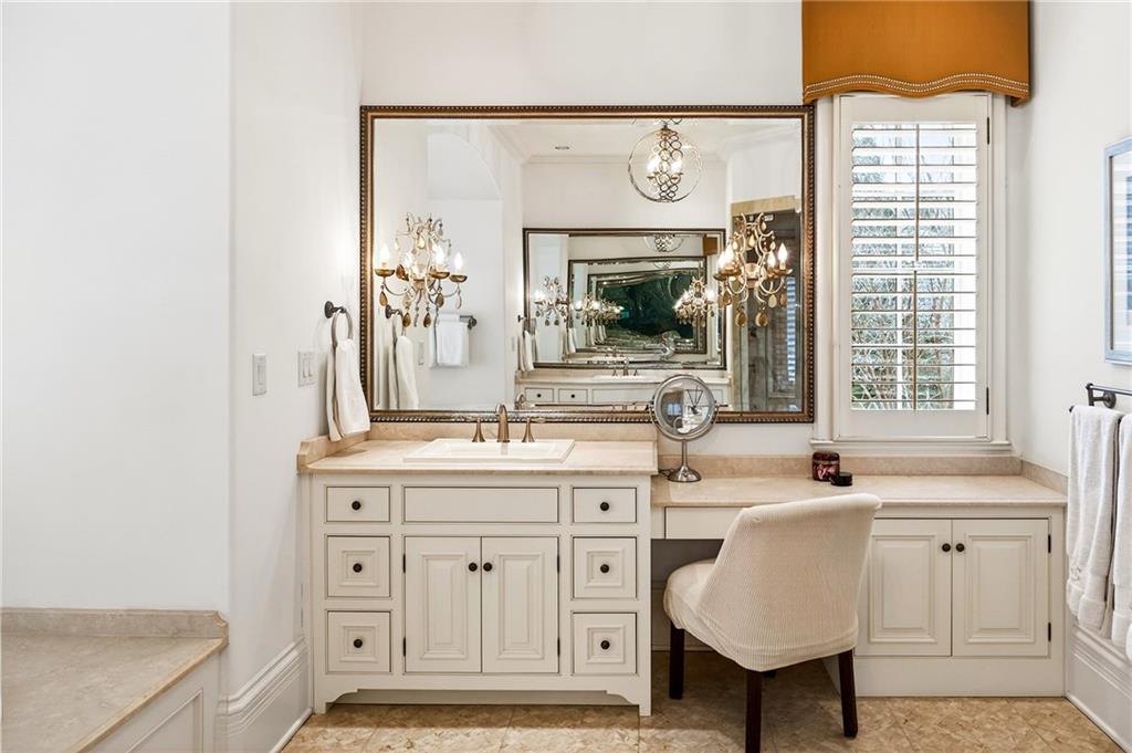 5148 Powers Ferry Road Northwest Sandy Springs, GA 30327 - Photo 28 of 63 a bathroom with a sink and a mirror