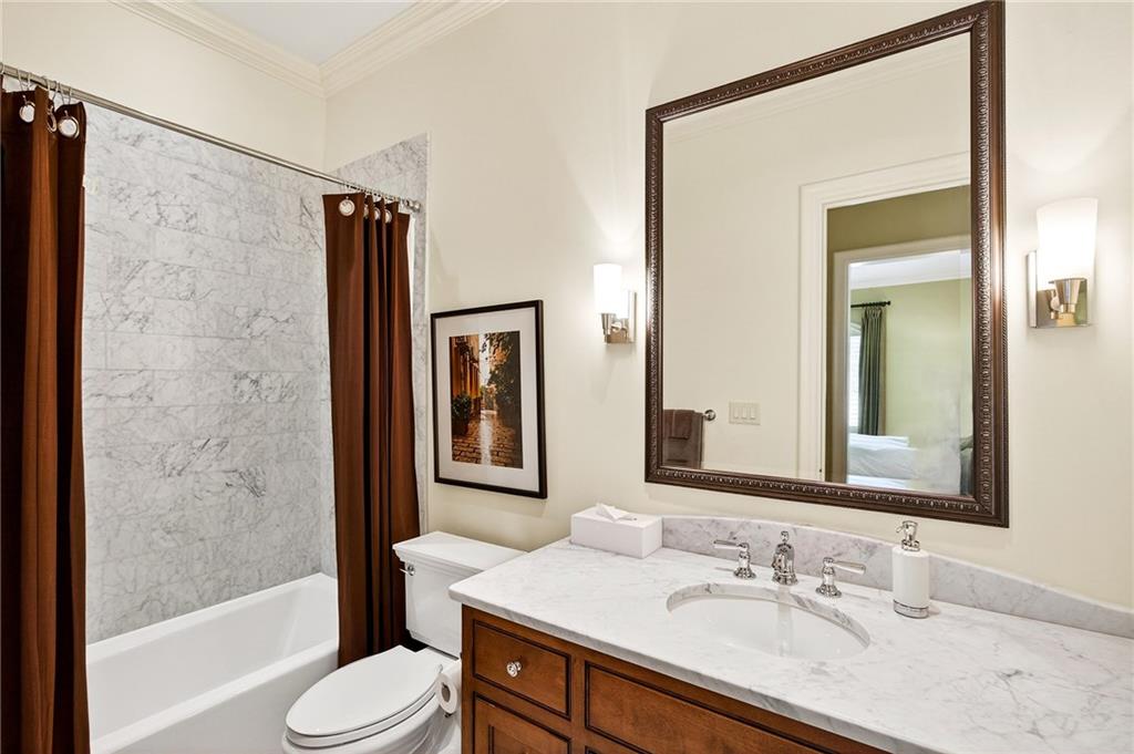 5148 Powers Ferry Road Northwest Sandy Springs, GA 30327 - Photo 31 of 63 a bathroom with a granite countertop sink toilet and shower