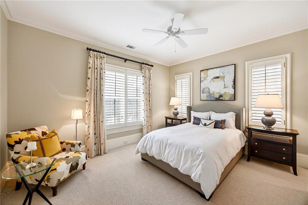 5148 Powers Ferry Road Northwest Sandy Springs, GA 30327 - Photo 32 of 63 a bedroom with a bed and furniture
