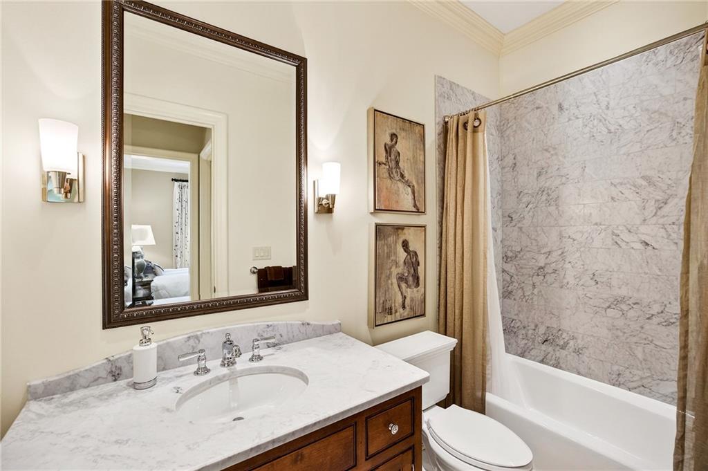 5148 Powers Ferry Road Northwest Sandy Springs, GA 30327 - Photo 33 of 63 a bathroom with a sink toilet and shower
