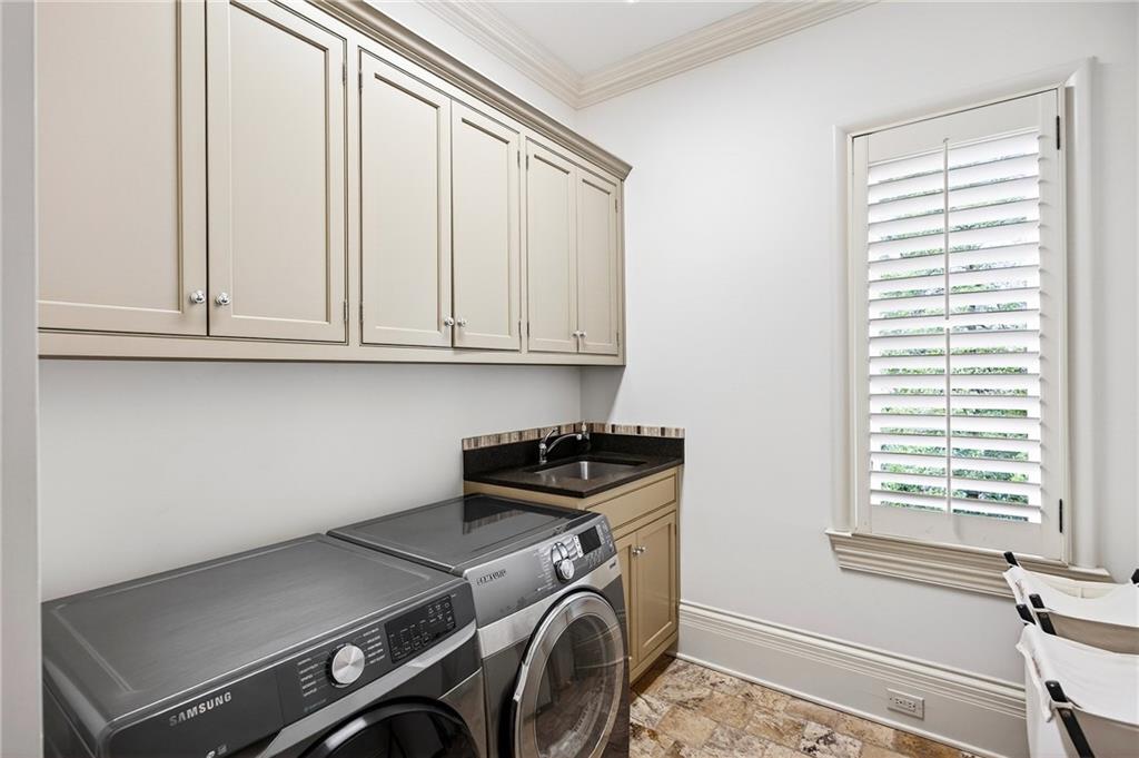 5148 Powers Ferry Road Northwest Sandy Springs, GA 30327 - Photo 34 of 63 a utility room with dryer and washer