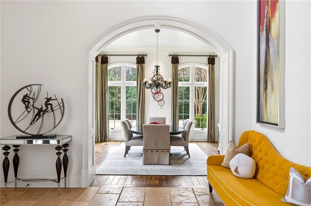 5148 Powers Ferry Road Northwest Sandy Springs, GA 30327 - Photo 4 of 63 a living room with furniture and a large window
