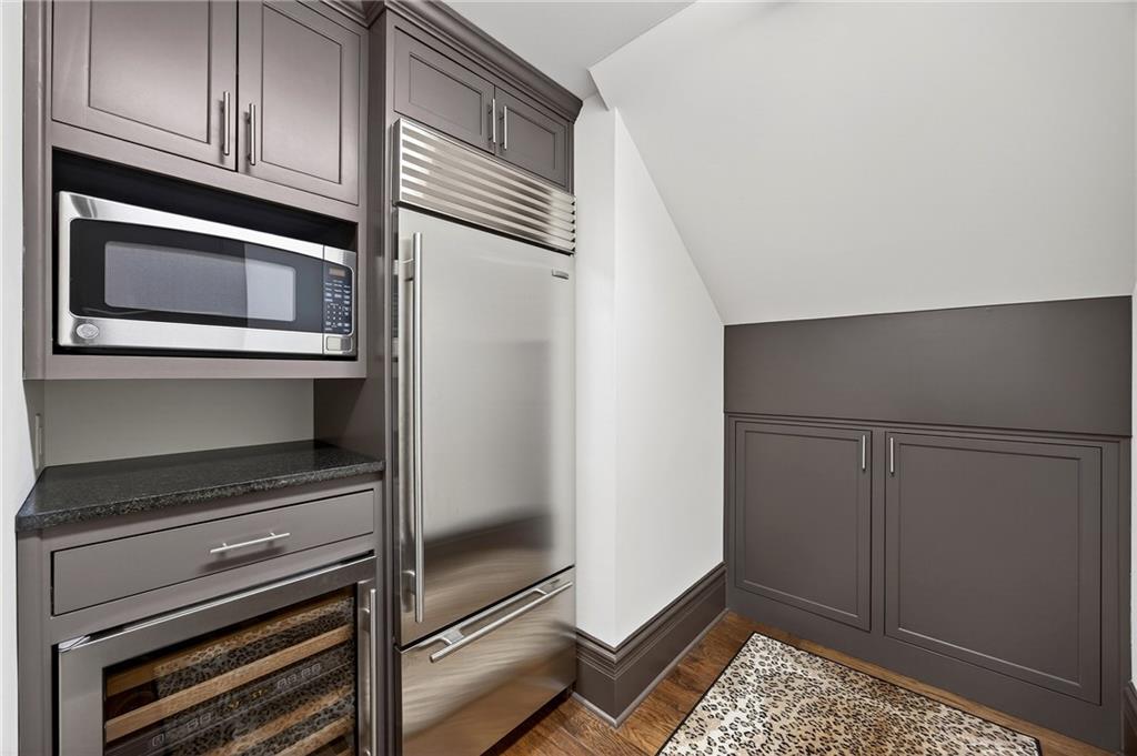 5148 Powers Ferry Road Northwest Sandy Springs, GA 30327 - Photo 42 of 63 a kitchen with granite countertop cabinets and steel stainless steel appliances