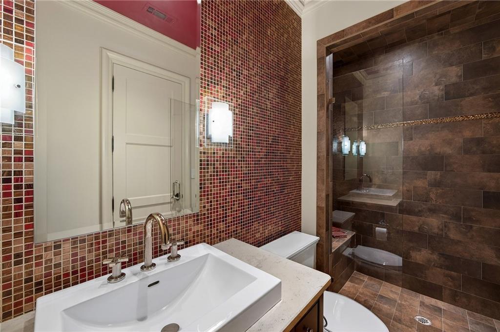 5148 Powers Ferry Road Northwest Sandy Springs, GA 30327 - Photo 43 of 63 a bathroom with a sink and a mirror