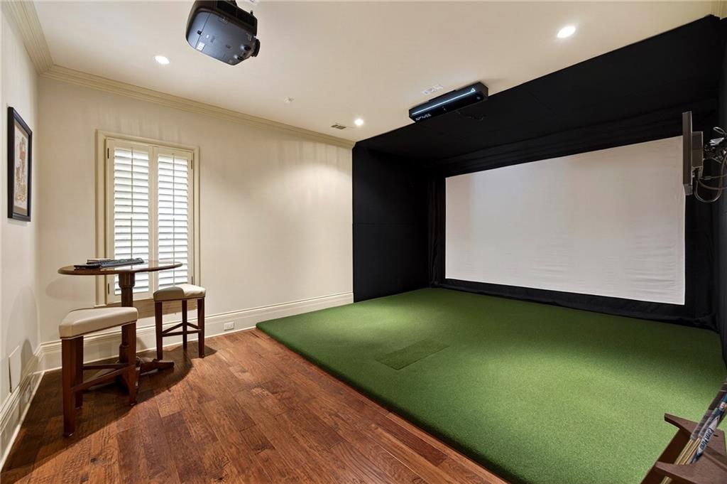 5148 Powers Ferry Road Northwest Sandy Springs, GA 30327 - Photo 45 of 63 a view of a projector room with a chair and a ceiling fan