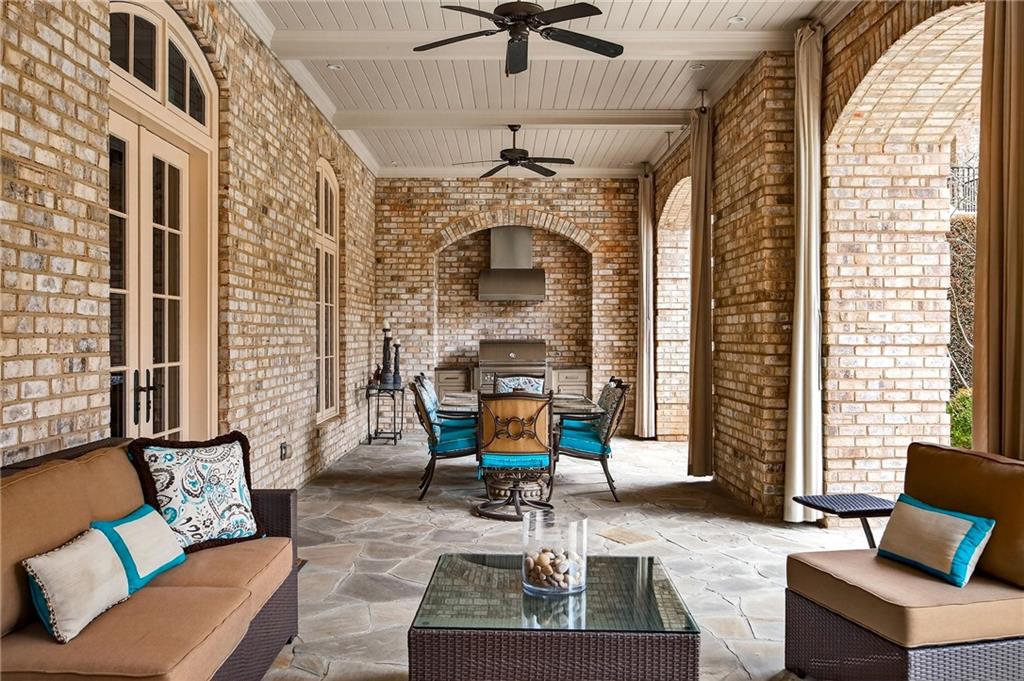 5148 Powers Ferry Road Northwest Sandy Springs, GA 30327 - Photo 48 of 63 a living room with furniture windows and a chandelier