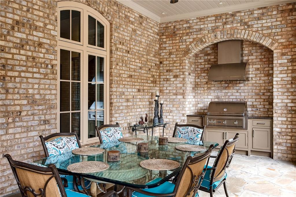 5148 Powers Ferry Road Northwest Sandy Springs, GA 30327 - Photo 52 of 63 a backyard of a house with table and chairs