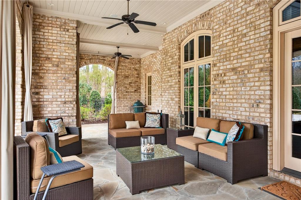 5148 Powers Ferry Road Northwest Sandy Springs, GA 30327 - Photo 54 of 63 a outdoor living space with patio furniture and a fireplace