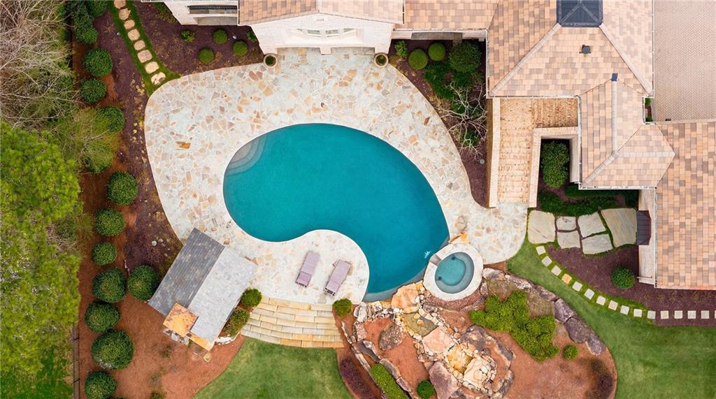 5148 Powers Ferry Road Northwest Sandy Springs, GA 30327 - Photo 61 of 63 an aerial view of a house with swimming pool and outdoor seating