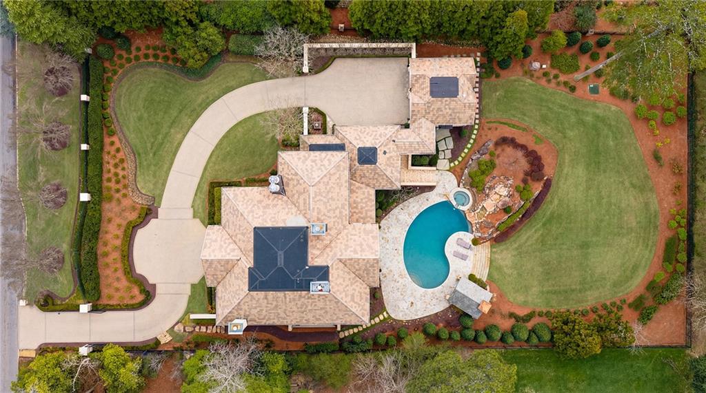 5148 Powers Ferry Road Northwest Sandy Springs, GA 30327 - Photo 62 of 63 an aerial view of a house with swimming pool and outdoor seating