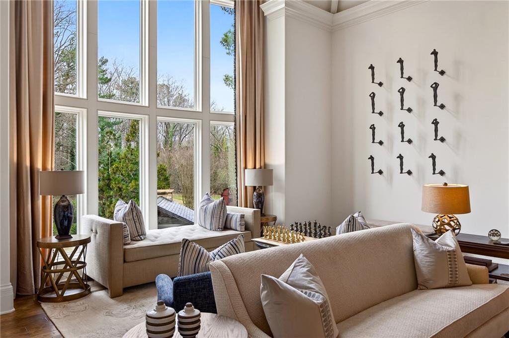 5148 Powers Ferry Road Northwest Sandy Springs, GA 30327 - Photo 8 of 63 a living room with furniture and a window