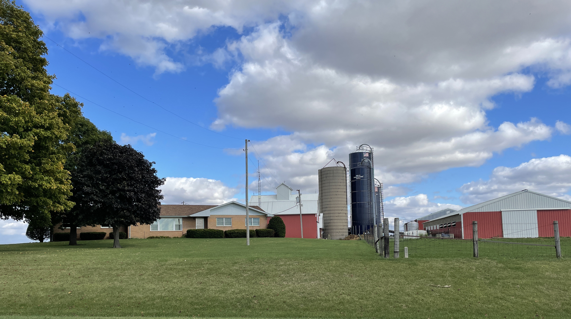 7849 Benson Road Lanark, IL 61046 - Photo 5 of 45 a view of a building with a big yard and large trees