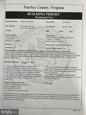 a view of dirt yard with a large tree