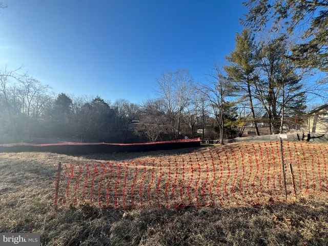 a view of a yard with a bench