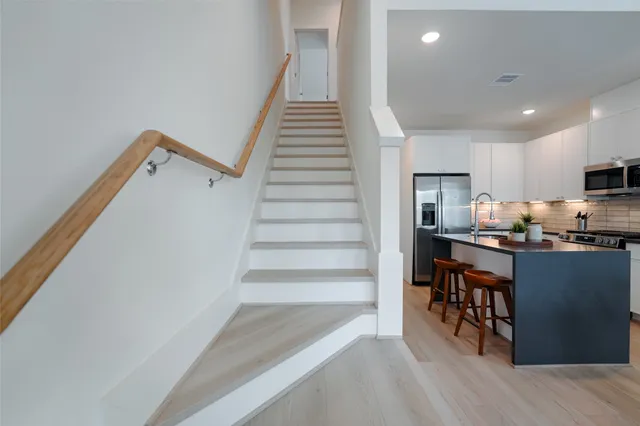a view of kitchen and wooden floor