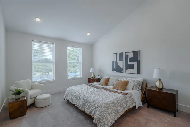 a bedroom with bed and a window