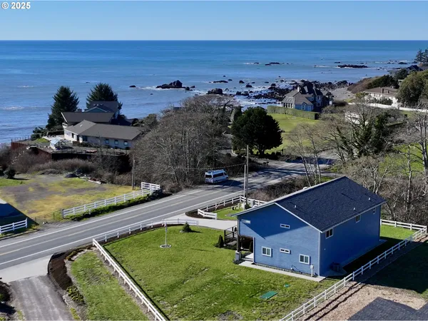 an aerial view of a house with a garden
