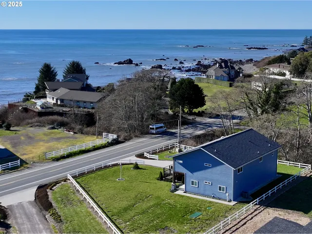 an aerial view of a house with a garden