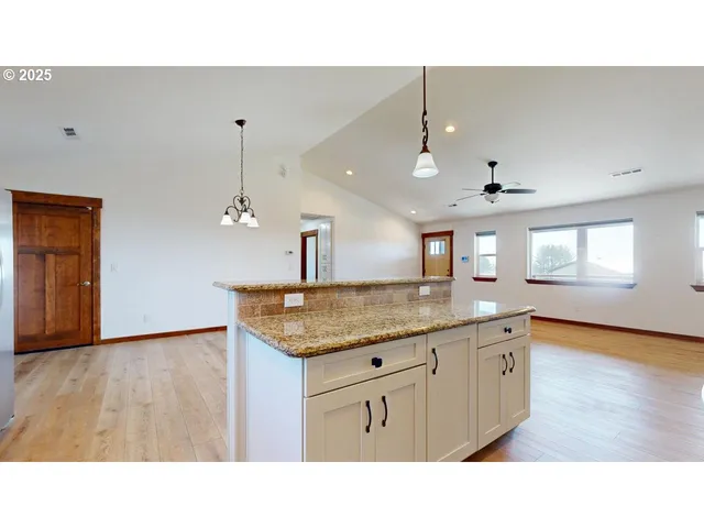 a kitchen with a refrigerator and a sink