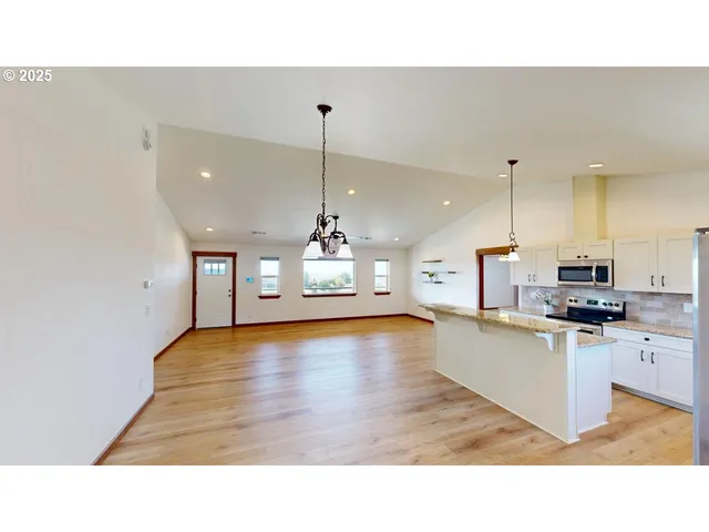 a black and white photo of a living room