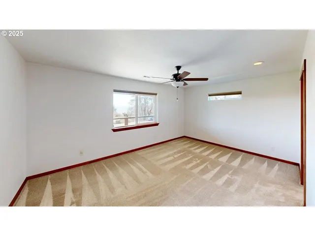 a open hall with a ceiling fan