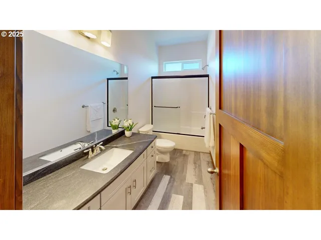 a bathroom with a sink and mirror