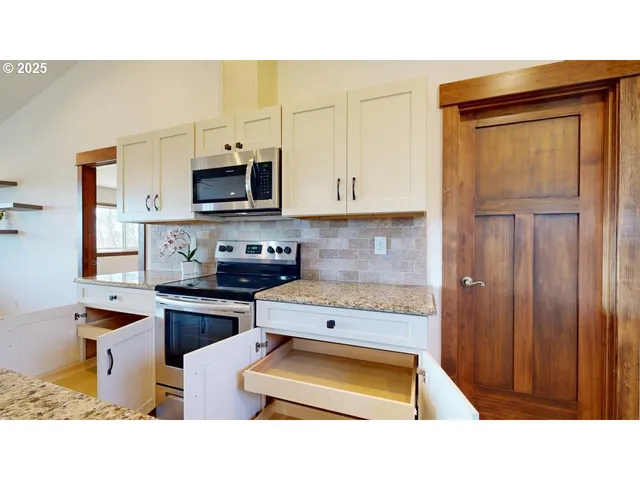 a kitchen with a sink a counter space and a window