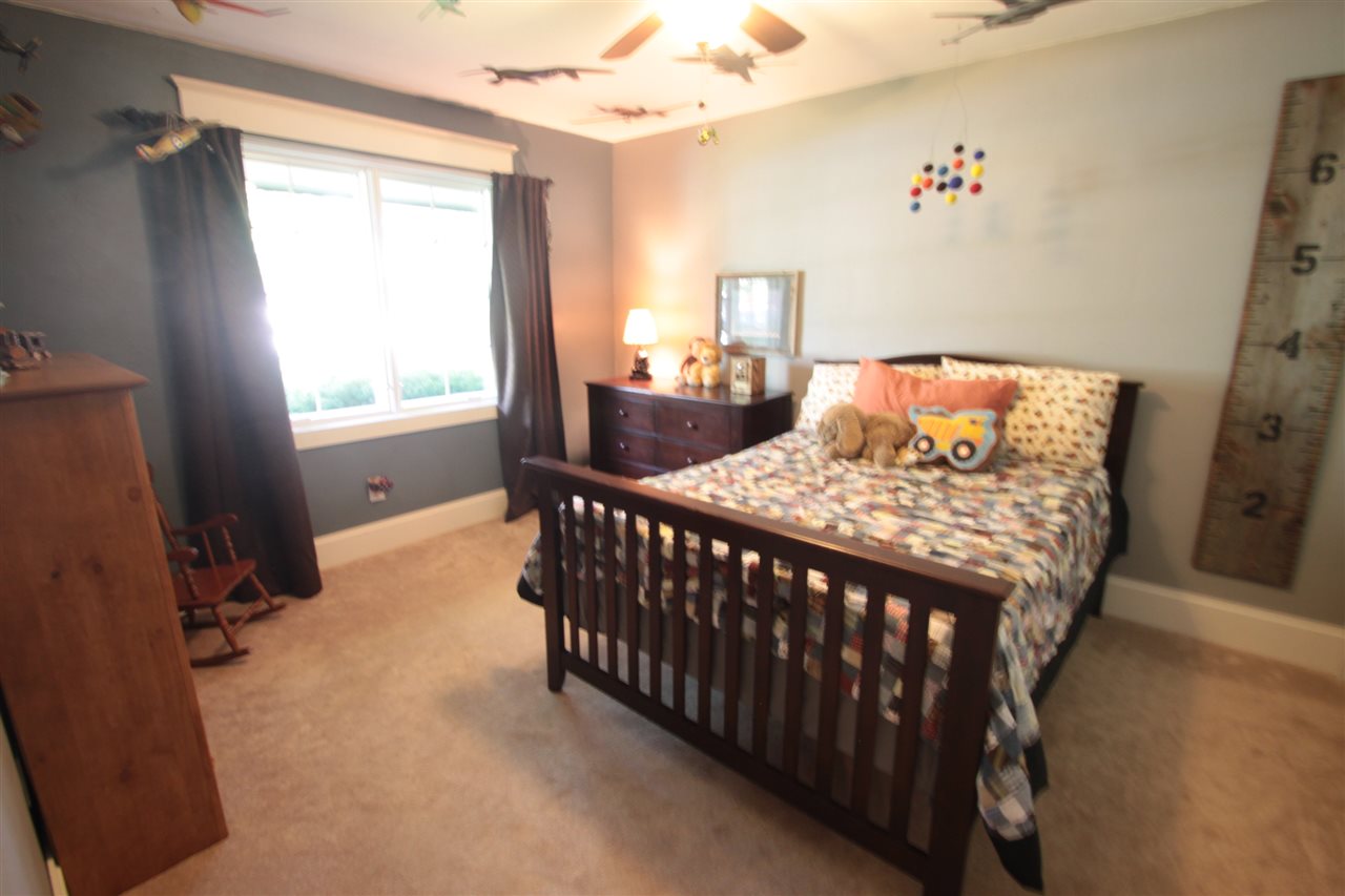 1138 Roxbury Road Rockford, IL 61107 - Photo 14 of 25 a bedroom with a bed and a window