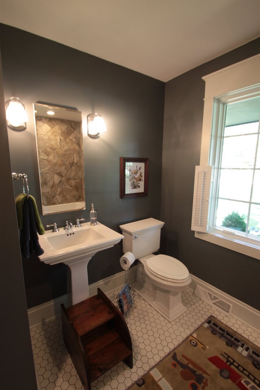 1138 Roxbury Road Rockford, IL 61107 - Photo 15 of 25 a living room with a couch and a table