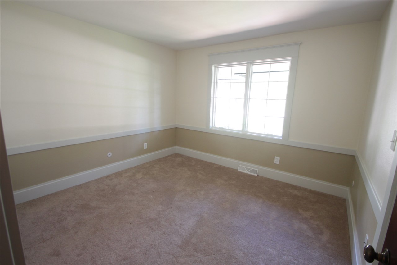 1138 Roxbury Road Rockford, IL 61107 - Photo 17 of 25 an empty room with a window