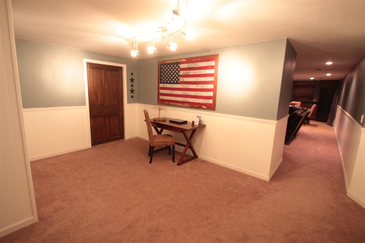 1138 Roxbury Road Rockford, IL 61107 - Photo 18 of 25 a view of a livingroom with furniture and a ceiling fan
