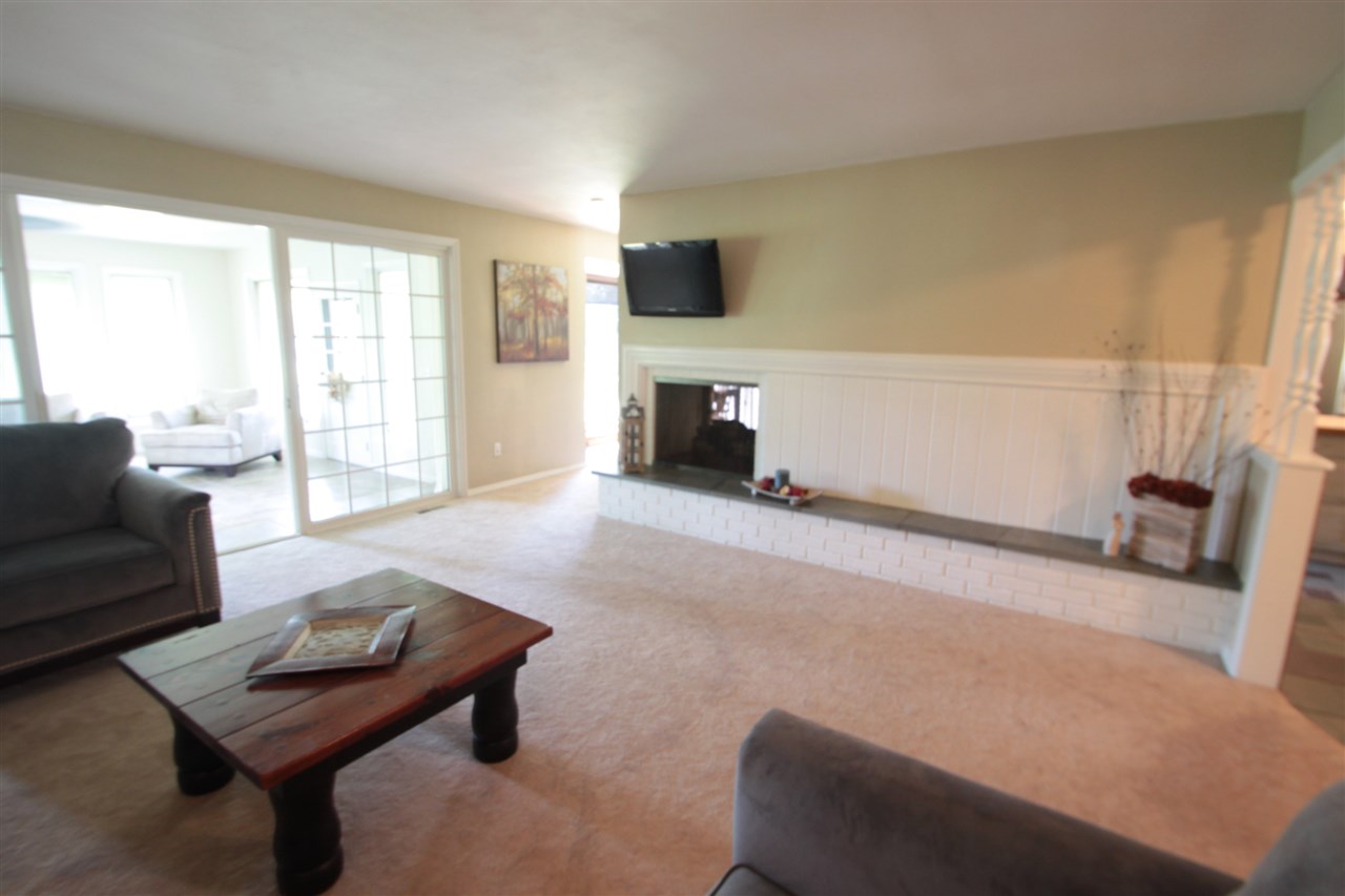 1138 Roxbury Road Rockford, IL 61107 - Photo 5 of 25 a living room with furniture and a fireplace