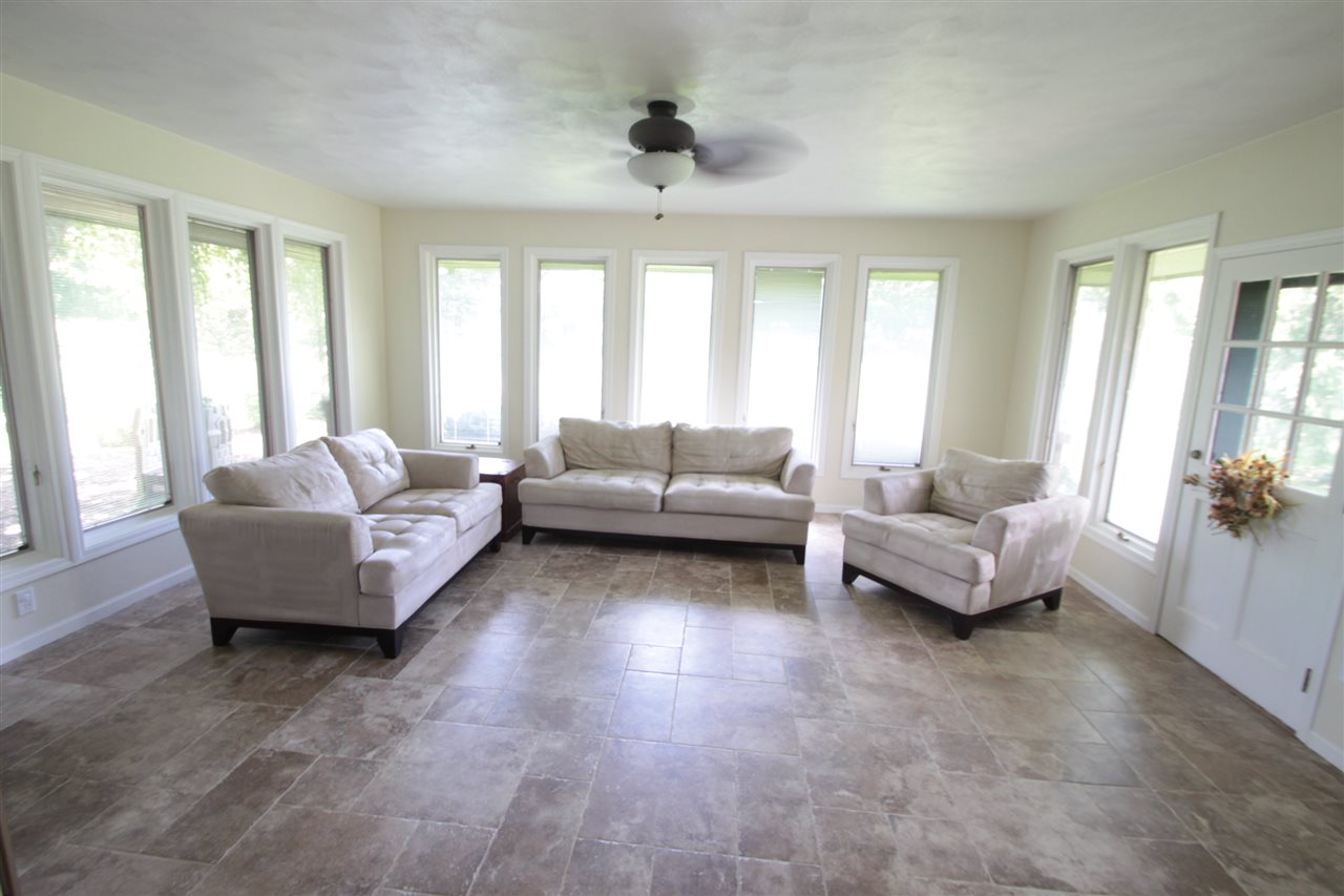 1138 Roxbury Road Rockford, IL 61107 - Photo 6 of 25 a living room with furniture and a large window