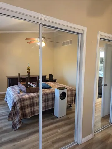 a bedroom with bed and a table