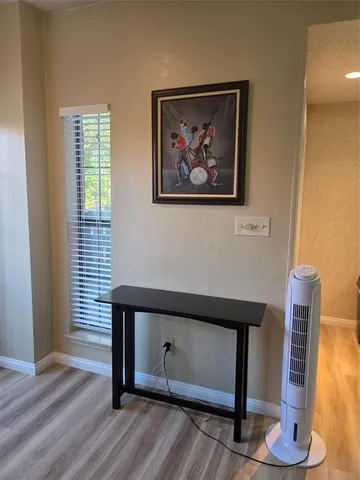 a view of entryway with wooden floor