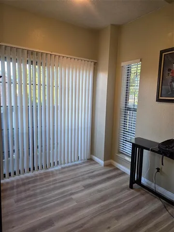 a view of a hardwood floor and wardrobe