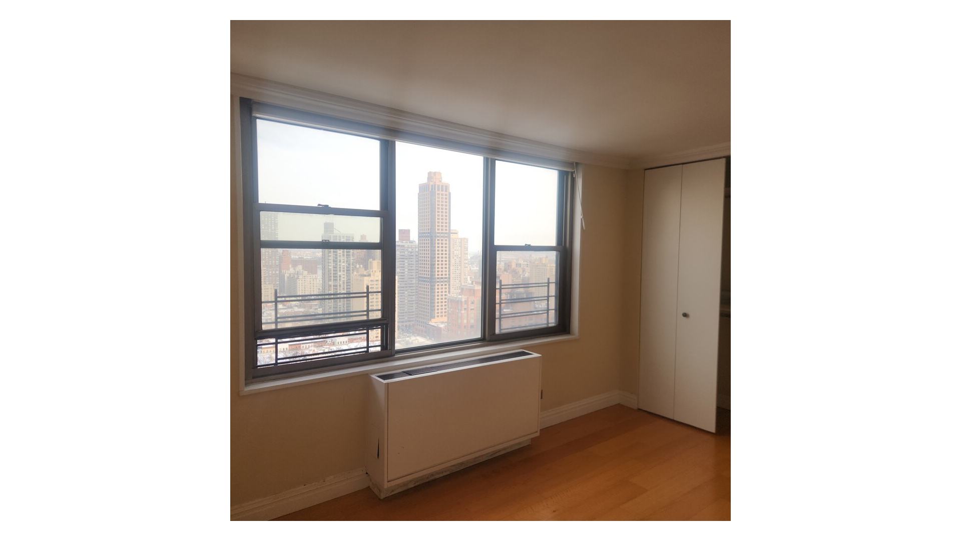 301 East 79th Street, Unit 32F Manhattan, NY 10075 - Photo 10 of 21 a view of an empty room with a window