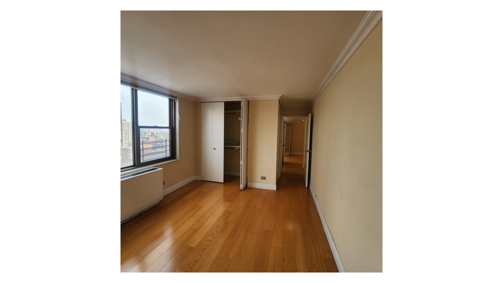 301 East 79th Street, Unit 32F Manhattan, NY 10075 - Photo 11 of 21 a view of an empty room with a window