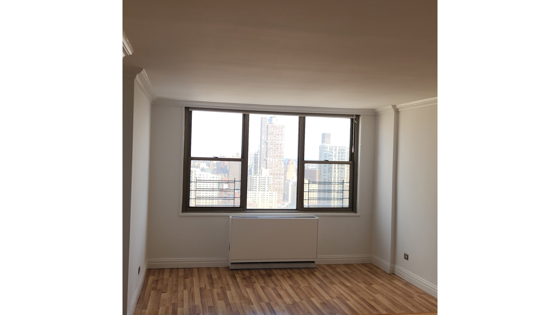 301 East 79th Street, Unit 32F Manhattan, NY 10075 - Photo 14 of 21 a view of an empty room with a window