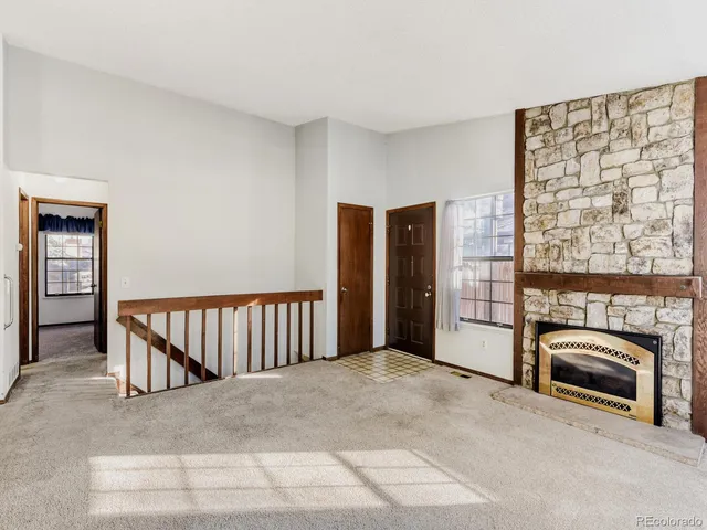 a view of a livingroom with a fireplace and furniture