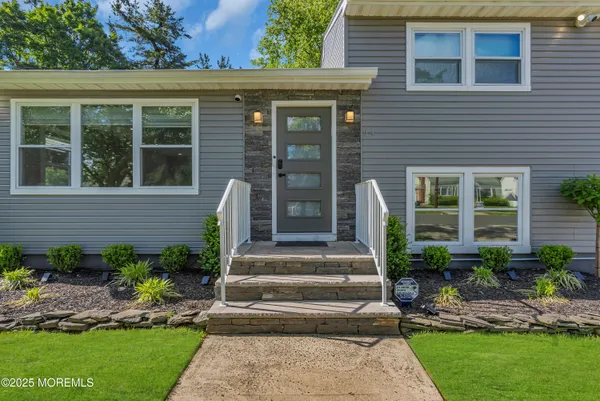 a view front of house with outdoor space and porch