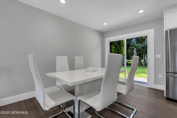 a view of a dining room with furniture and window