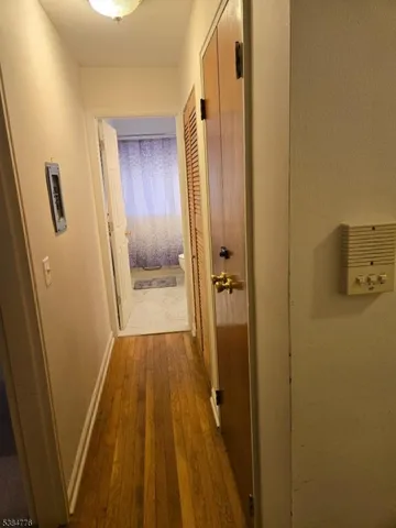 a bathroom with a sink and glass door shower