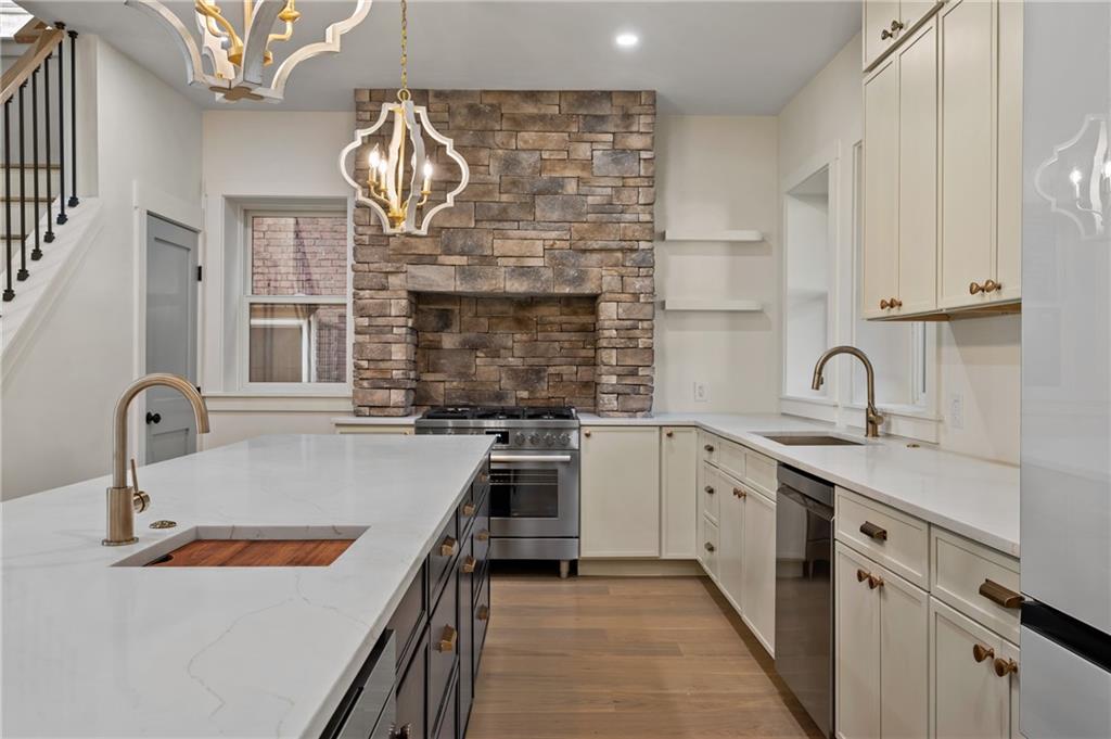 5563 Hampton Street Pittsburgh, PA 15206 - Photo 15 of 29 a kitchen with a sink and a stove top oven