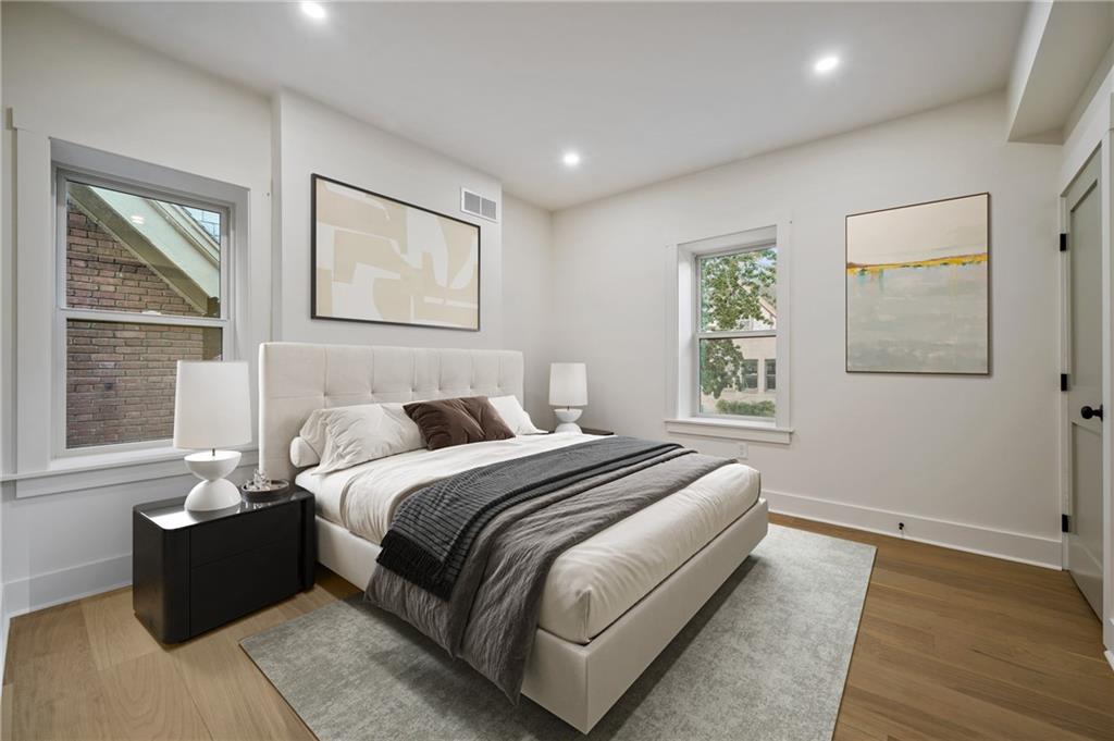 5563 Hampton Street Pittsburgh, PA 15206 - Photo 17 of 29 a bedroom with bed couch and window